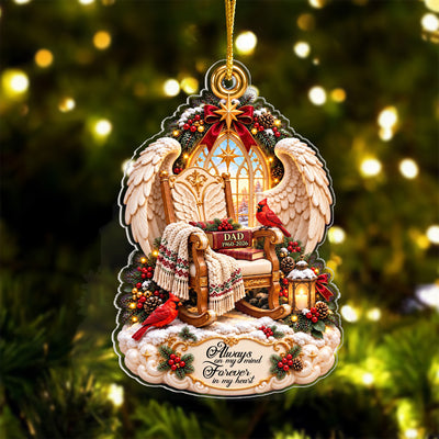 Personalized Angel Wings Memorial Acrylic Ornament against blurred golden tree lights, book reading DAD 1960-2026