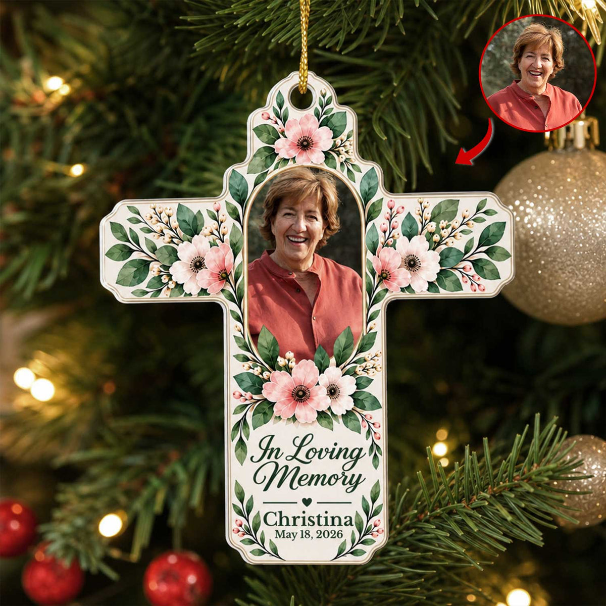 Personalized Floral Cross Acrylic Ornament on a lit Christmas tree, smiling woman in a red top, with photo inset