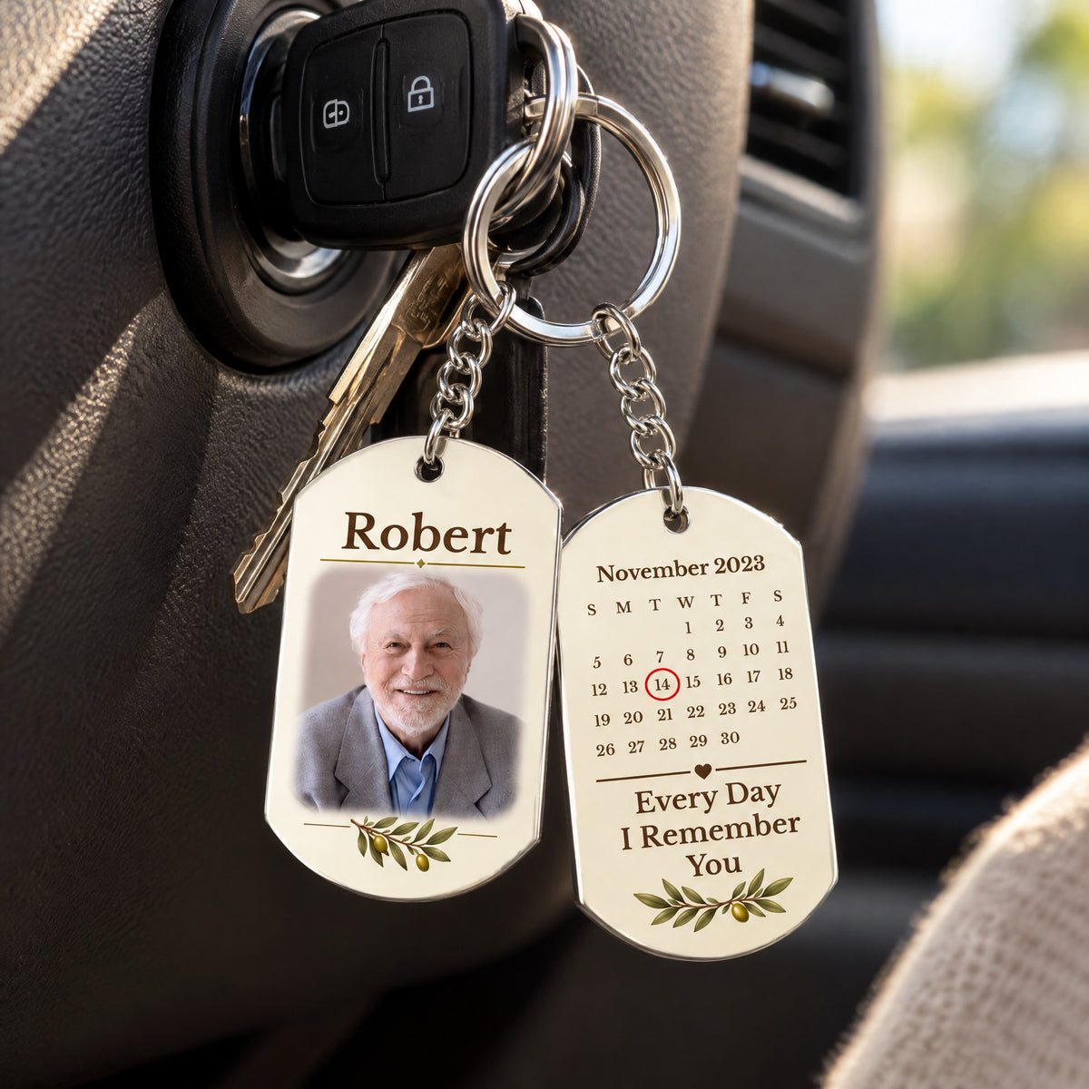 Personalized stainless steel memorial keychain hanging from car keys in the ignition, both sides in view