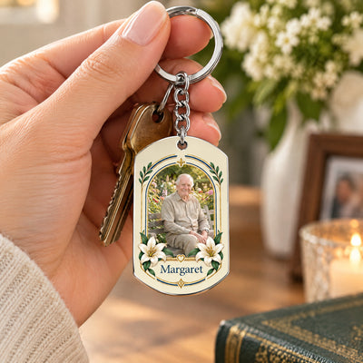 Personalized Stainless Steel Keychain held with keys in a hand, with white flowers and a candle behind